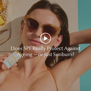Woman applying SPF 50 sunscreen to her face as part of a daily skincare routine to protect against ageing, sunburn, and blue light.