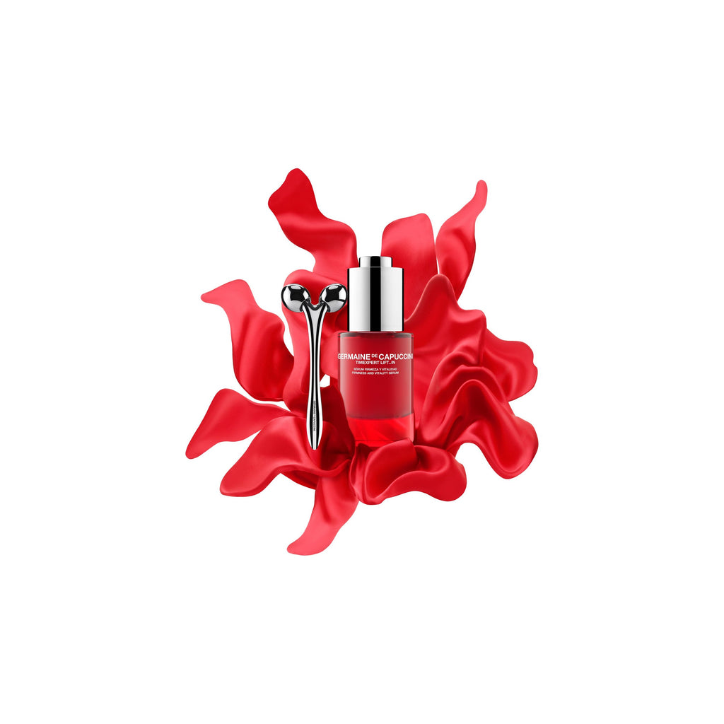 Timexpert Lift_IN Promo Firmness and Vitality Serum red bottle with Face Massage roller device, front side, in red silk background 