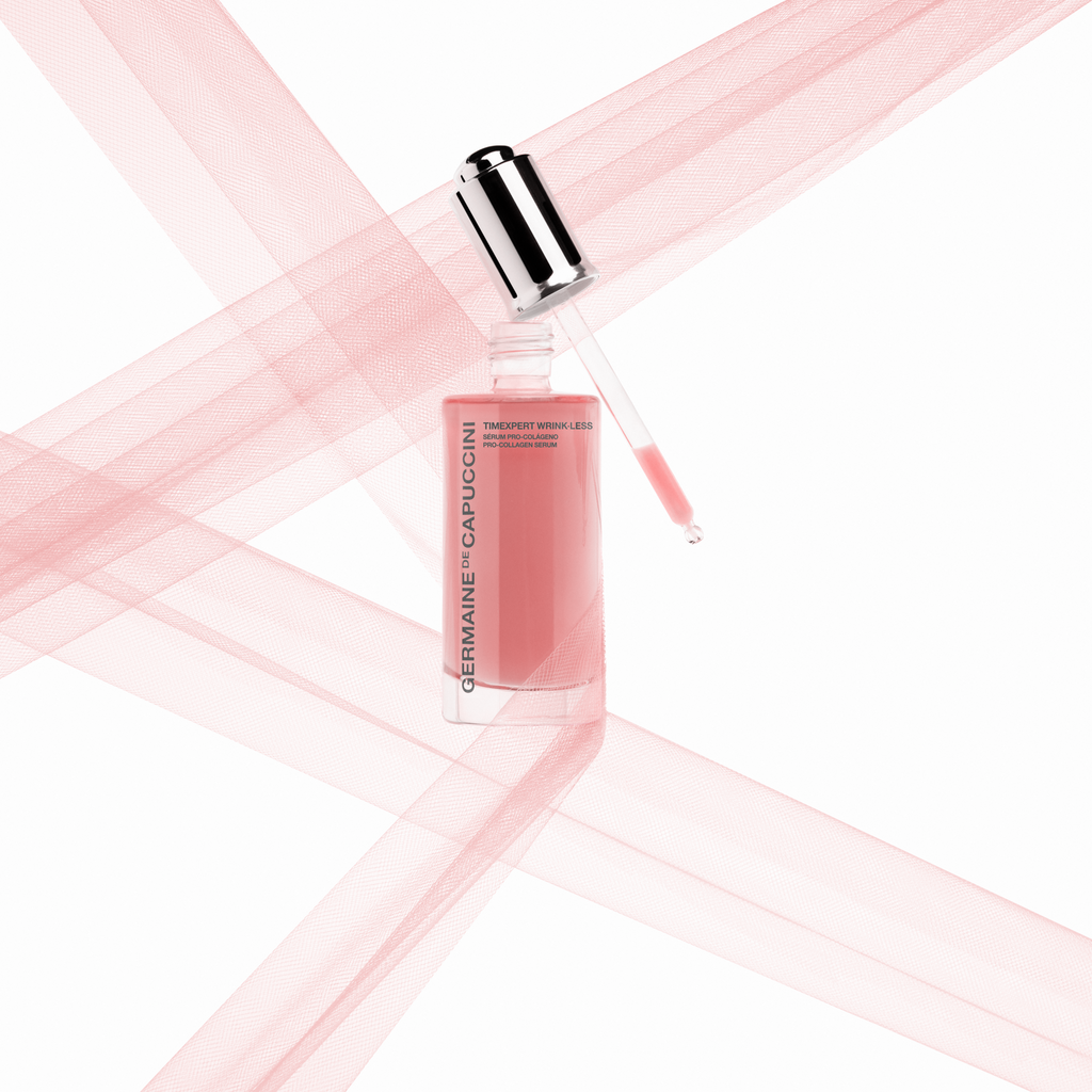 Cosmetic bottle with pink liquid on a white background